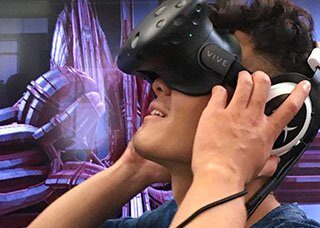 A student views a rendering through virtual reality headset