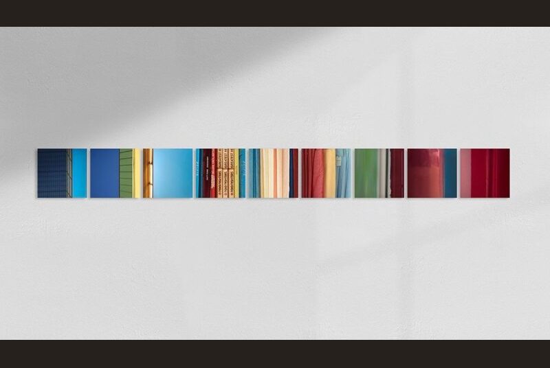 A thin strip of color is colorized by the sides of houses, book spines, fabric and painted walls