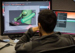 A student animates a character in the viz lab