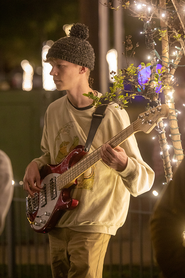 A guitarist performs with a band at the Lights On! event.