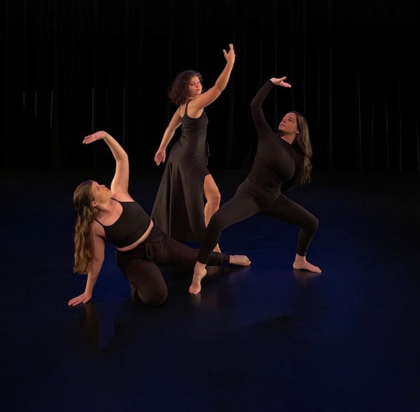 Three dancers perform