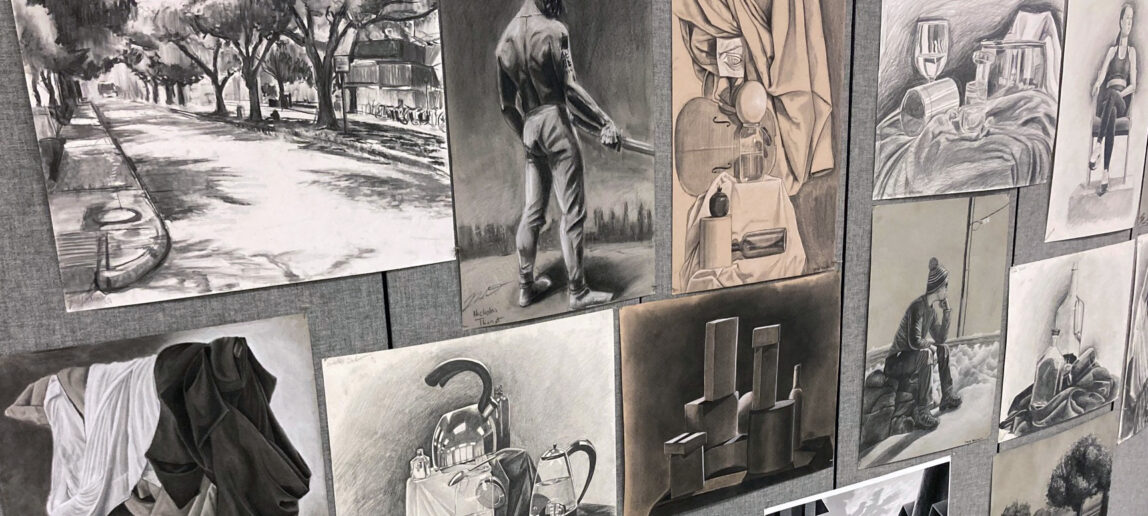 A series of drawings on display.