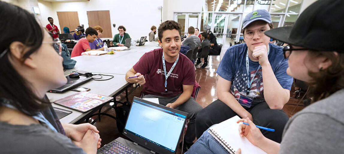 Four college students discuss creating a game at the Chillennium game jam.