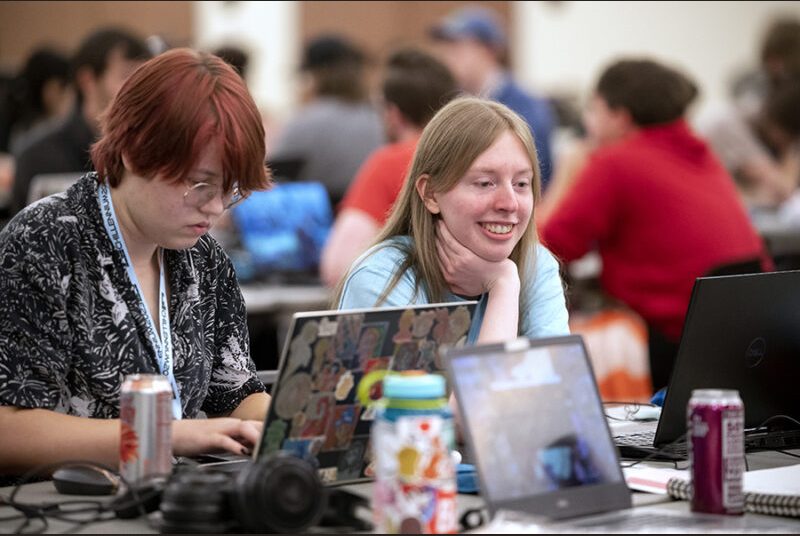 Two college students work on creating a game at the Chillennium game jam.