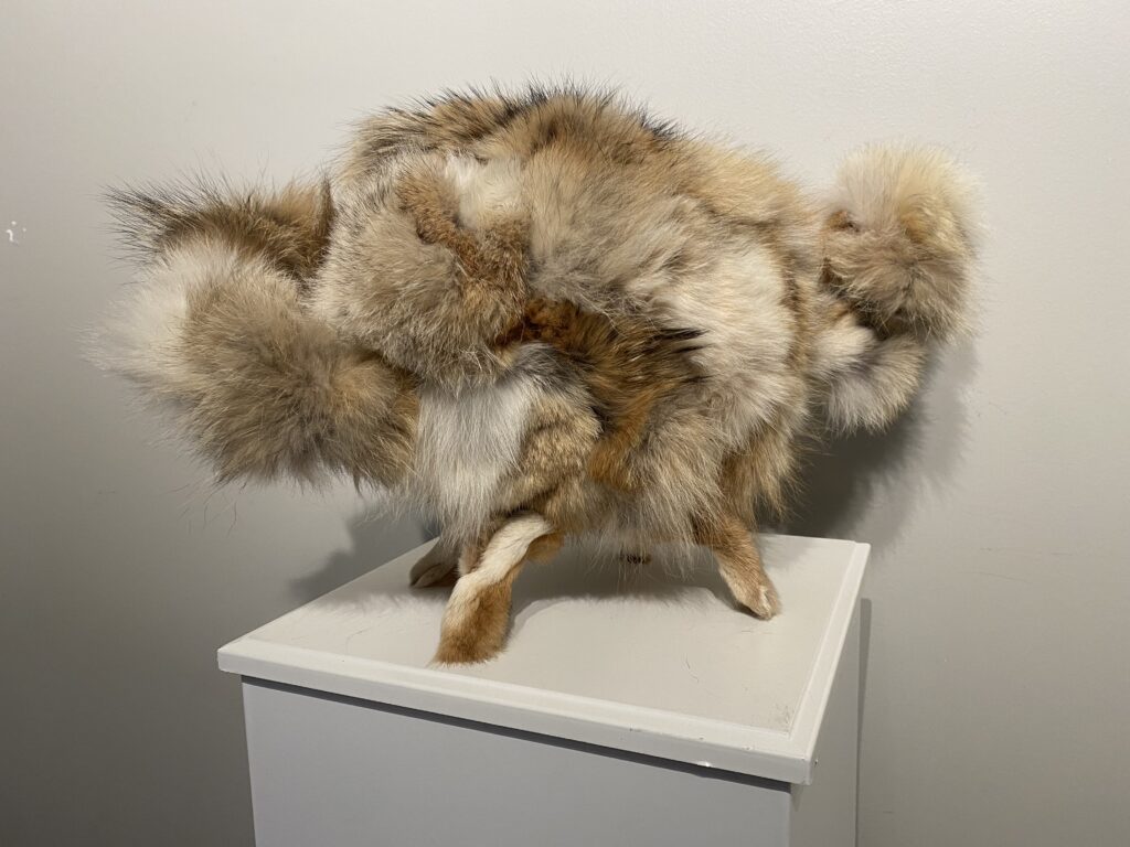 An art sculpture that incorporates taxidermy and artificial intelligence,.