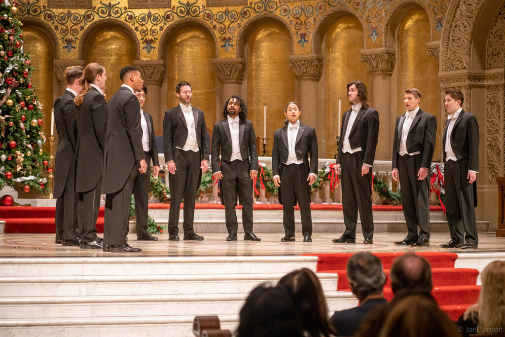 A 12-member a cappella group performs.