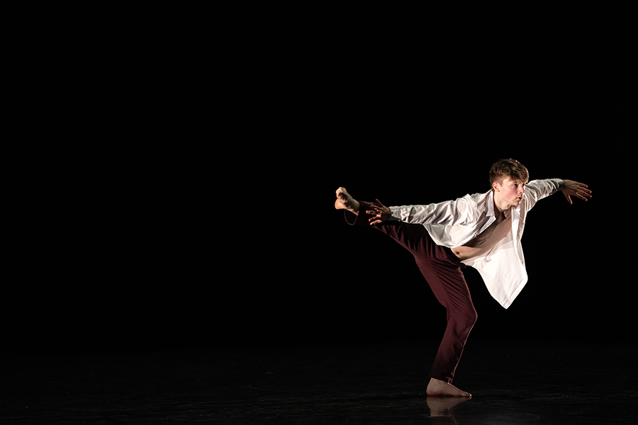 A solo dancer performs onstage.