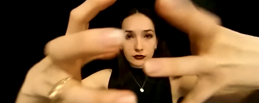 A clip from a 360-degree video is shown, featuring a college student with her hands reaching out toward the camera.